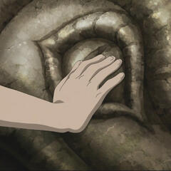 Zuko's hand touching a dragon statue.